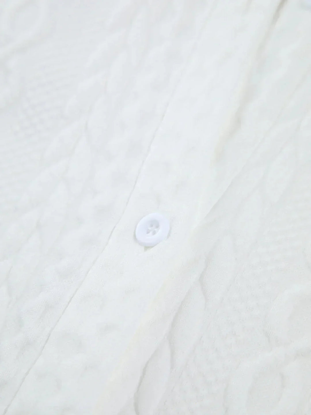 Blouse blanche texturée femme à manches sculptées