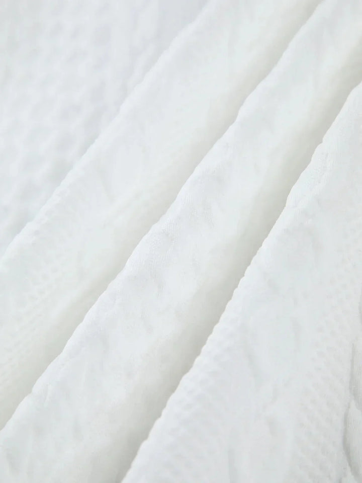 Blouse blanche texturée femme à manches sculptées