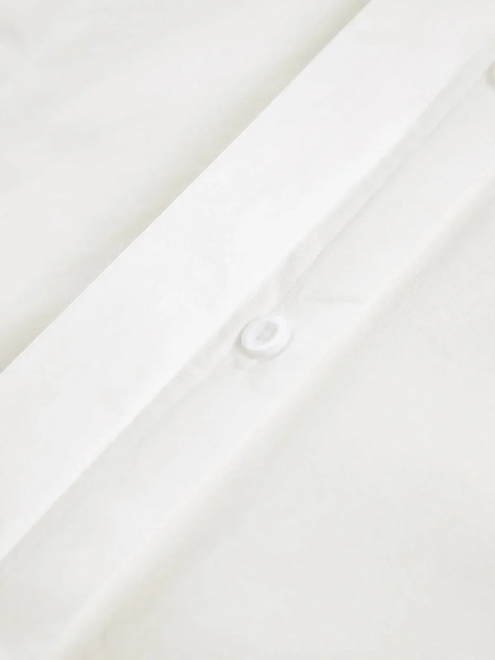 Chemise blanche oversize femme à épaules structurées et col en V